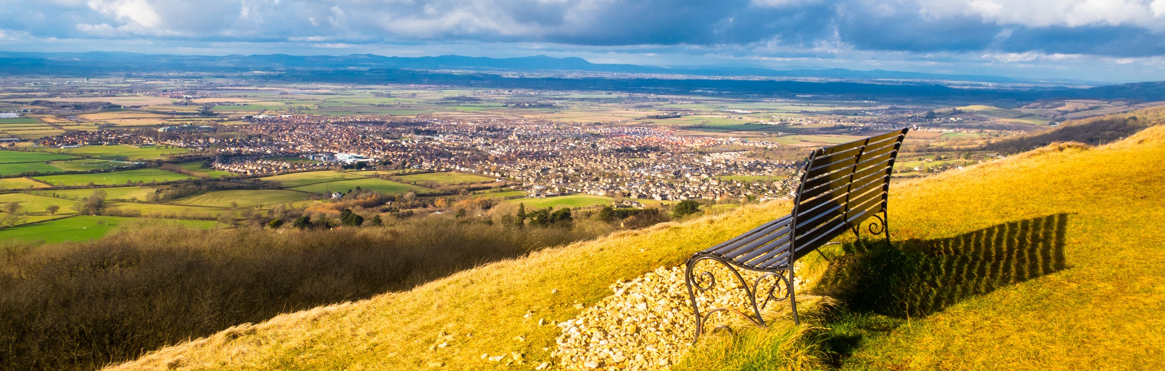 Bench overlooking hills in Cotswolds where Angelfish is based